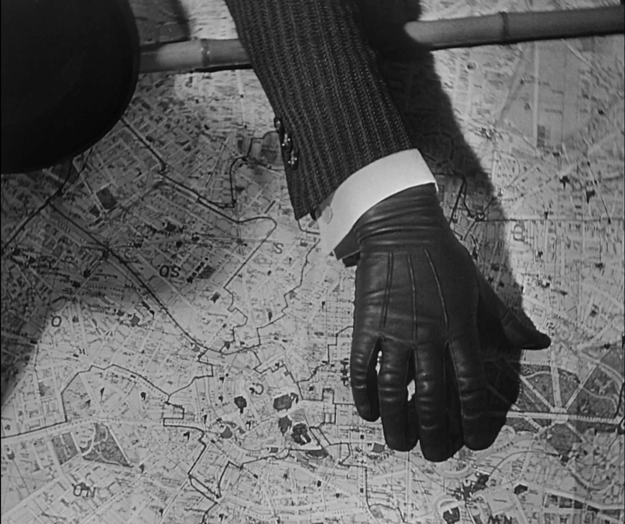 The criminal's hand on a map in M (Fritz Lang, 1931)